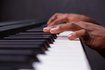 Fototapeta na wymiar hands of a person playing the piano