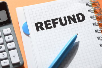 REFUND text written on notepad. BUSINESS CONCEPT.