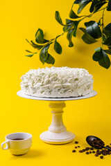 Coffee Mousse Cake with Coffee Cup on Yellow Background