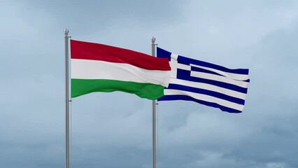 Greece flag and Hungary flag waving together on cloudy sky, endless seamless loop, two country relations concept
