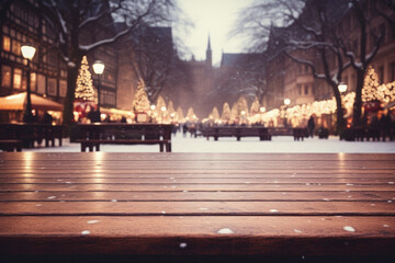 Fototapeta na wymiar Wooden table in front of christmas market. Blurred background.