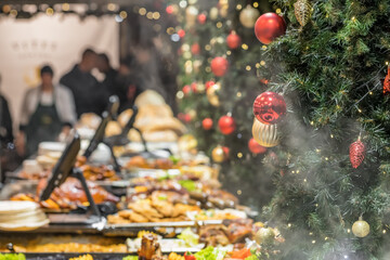Street food at stalls of the traditional Christmas market in Europe - obrazy, fototapety, plakaty