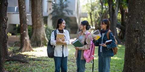 Happy young student chat with each other after class. Guy and girls wear casual clothes to study....