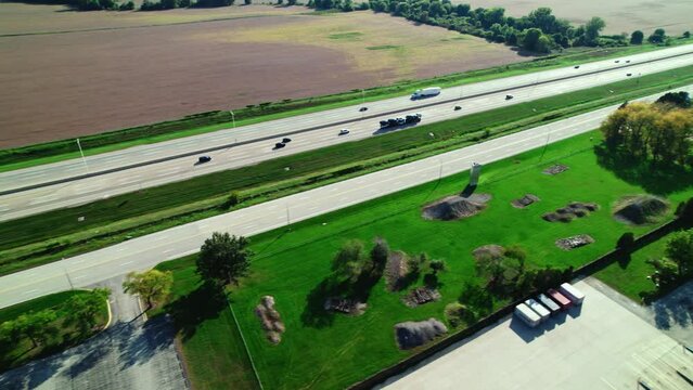 following a Car hauler carriage on highway. CDL truck driver job. Aerial