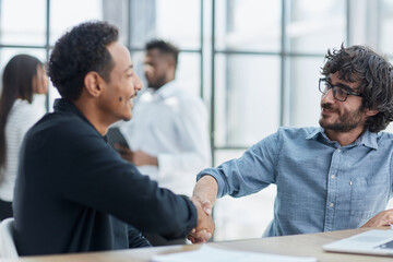 Successful Business Collaboration: Executives Greet with Handshake in Office