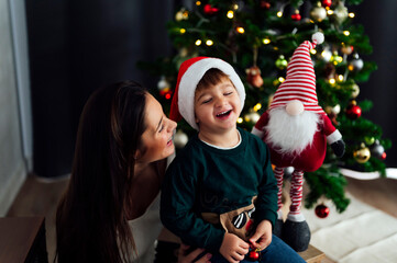 Mother with her son at Christmas time at home