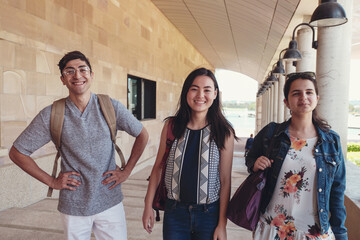 Happy multicultural students in library