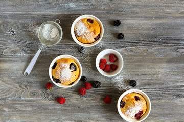 sweet cupcakes with summer berries, top view