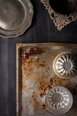 Various old kitchen objects on black chalkboard background