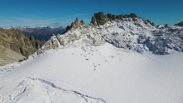 spectacular view of high altitude glacier and glacial lake below sharp rocky Poncione di Cassina Baggio mountains featuring famous Swiss passes Gerenpass and  Passo di Mani&oacute; near Ch&uuml;ebodengletscher 