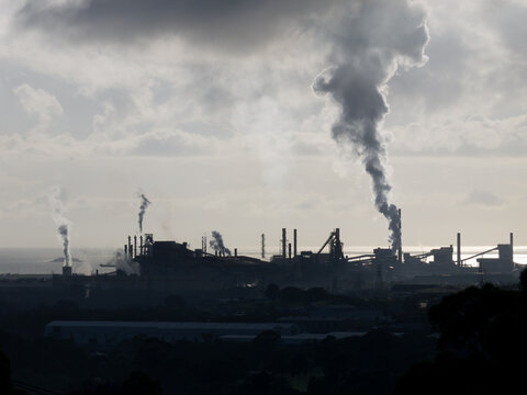 Port Kembla Steel Works silhouetted in the distance emitting steam