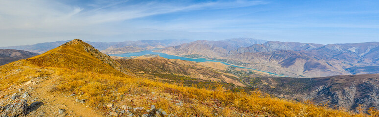 panoramic view of Chorvoq lake and Chatkal Mountains from the top of Smaller Chimgan (Bostanliq...