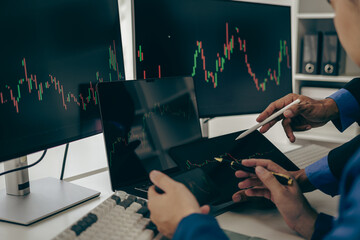 Stock trader looking at stock market chart on screen, analyzing investment strategy, finance...