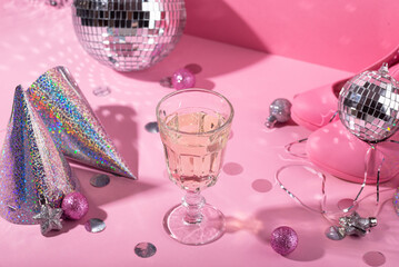 Glass of champagne with silver disco ball