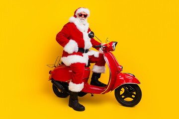 Full length photo of fat grandfather working courier fast express delivery christmas spirit ride moped isolated on yellow color background - obrazy, fototapety, plakaty