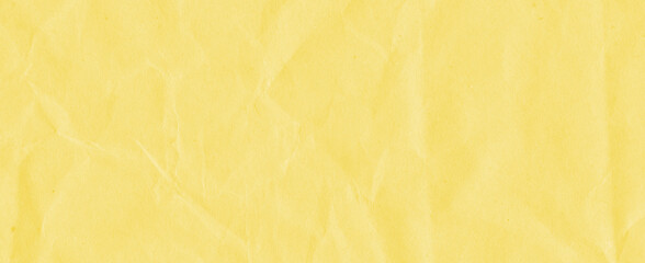 Obraz na płótnie Canvas Recycled crumpled yellow paper texture background. Royalty high-quality free stock photo image of Wrinkled and creased abstract backdrop, wallpaper with copy space, top view