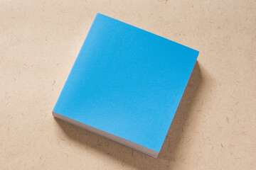 青色の表紙で四角い本（柄の無いモックアップ）