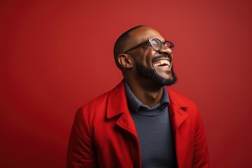Smiling Man in Vibrant Red Jacket Poses for the Camera