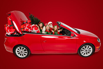 Photo of charming pretty santa claus helpers riding car delivering presents isolated white color...