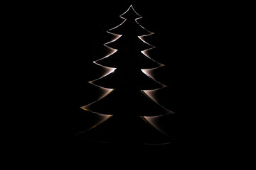 Obraz premium Christmas tree shape cut out white paper Creative concept Holiday Xmas card Happy New Year celebration Christmas