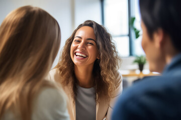 A worker and co-workers are meeting at the office to have a small talk and discuss in a happy atmosphere at day time. Generative AI.