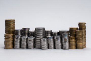 Pile of coins isolated on a white background.