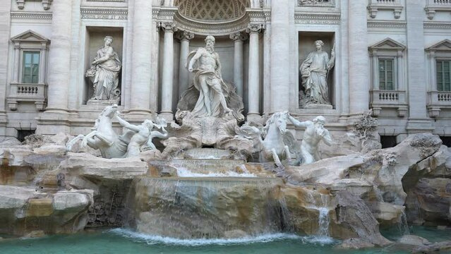 Detail front view of Trevi Fountain in Italian language Fontana di Trevi is fountain in Trevi district designed by Italian architect Nicola Salvi and completed by Giuseppe Pannini, slow motion.