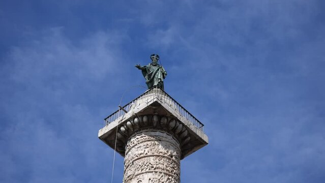 Close-up sculpture on top of ancient Egyptian obelisk - Obelisco Agonale on Piazza Navona in Rome on sunny day on background of blue sky. Fountain of Four Rivers - Fontana dei Quattro Fiumi.