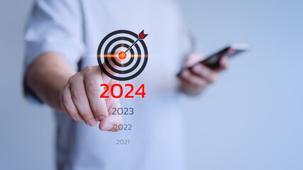 Male hand touching the goal icon from 2021 to 2024 for goal, good health, start up, life balance,...