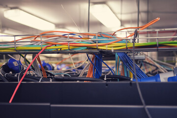 There are many wires running through the cable tray in the server room. Security is paramount in the computer industry, especially in server rooms.
