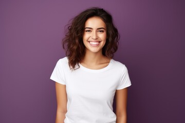 Fototapeta premium A Woman Posing Elegantly in Front of a Vibrant Purple Wall