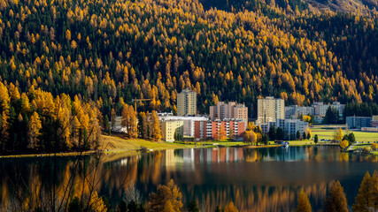 Magnificent autumn atmosphere of St.Moritz, famous and luxury ski resort town, located in the upper Engadin valley in the south-eastern corner of Switzerland. Colorful accommodation buildings.
