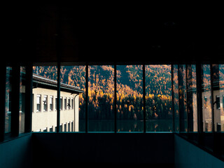 Magnificent autumn atmosphere of St.Moritz through glass window. Famous and luxury ski resort town, located in the upper Engadin valley in the south-eastern corner of Switzerland.