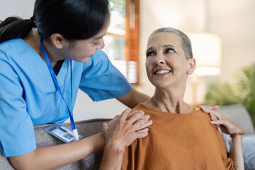elderly touch hand on back of hand caregiver or nurses to express thankful