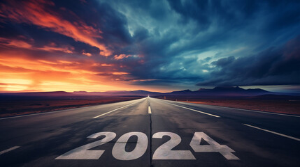 2024 is written on a road that stretches into the distance, as a symbol of the coming new year. dramatic sky - obrazy, fototapety, plakaty
