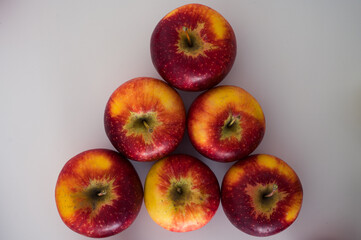 Pyramid of red apples frome the top. Organic fresh fruits and image of fall harvest background