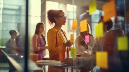 Business people meeting at office and use post it notes to share idea.Profession businesswomen,businessmen and office workers working in team conference Brainstorming concept.Sticky note on glass wall