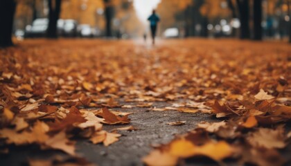 Running or Jogging outdoors in rainy autumn weather with leaves in warm colors on the ground.