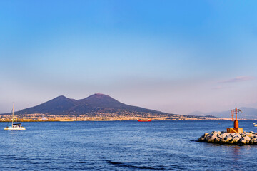 Vesuvius seen and fish boats from the seafront of Naples
