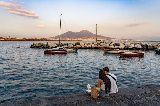 Vesuvius seen and fish boats from the seafront of Naples