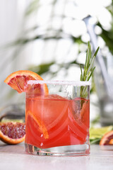 Red Sicilian Orange Paloma Cocktail of tequila, fresh lime and rosemary with red Sicilian orange...
