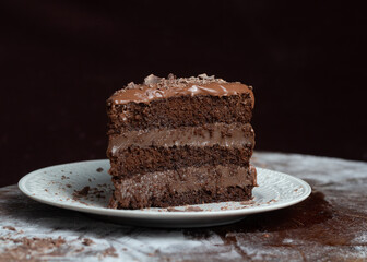 Chocolate cake or brigadeiro cake whole or slice in a white plate