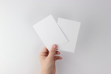 Card mockup in minimalist style, two blank cards in hand