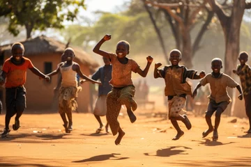 Abwaschbare Fototapete African kids children dancing in village © blvdone