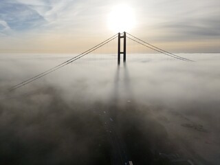 Fototapeta premium aerial view of the Humber Bridge in the morning mist over the river humber 