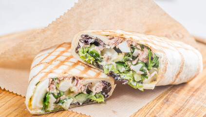 Pita roll with chicken and vegetables filling. Shawarma in pita bread stuffed with vegetables and meat