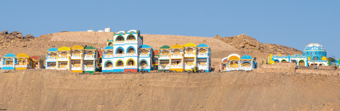Colorful houses of Aswan, Nubian village, in Egypt during a sunny summer day