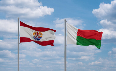 Madagascar and French Polynesia flags, country relationship concept