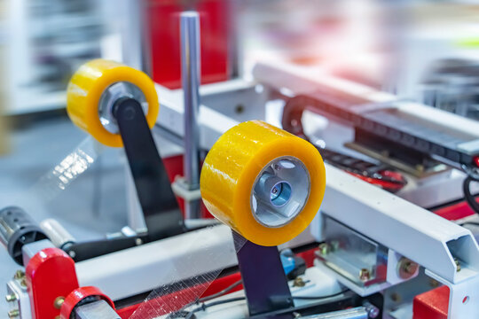 adhesive tape and cardboard in production line for packing product