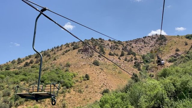 moving up on a chair lift in the summer on the Chimgan mountains